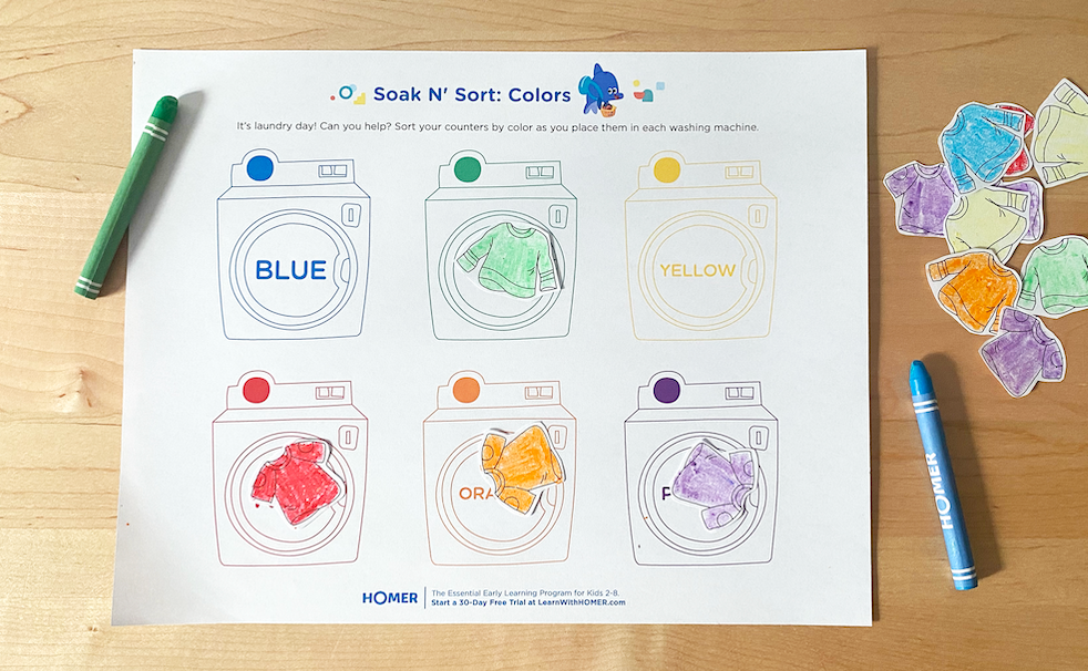 Completed Soak n Sort printable on table with crayons