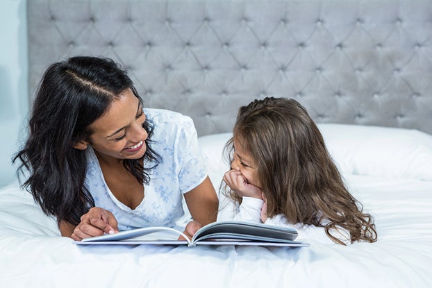 Mom supporting child's skills learned as a 2nd grader
